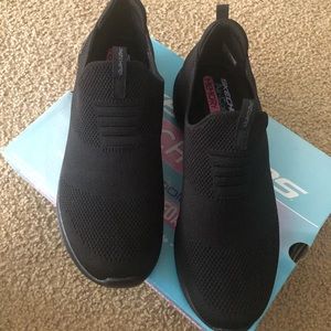 All Black Skechers sneakers